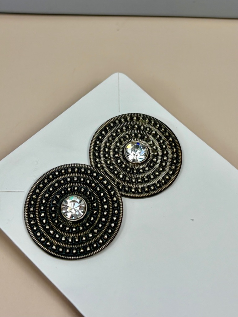 Brutalist Style Circular Textured Metal Stud Earrings with Clear Crystals